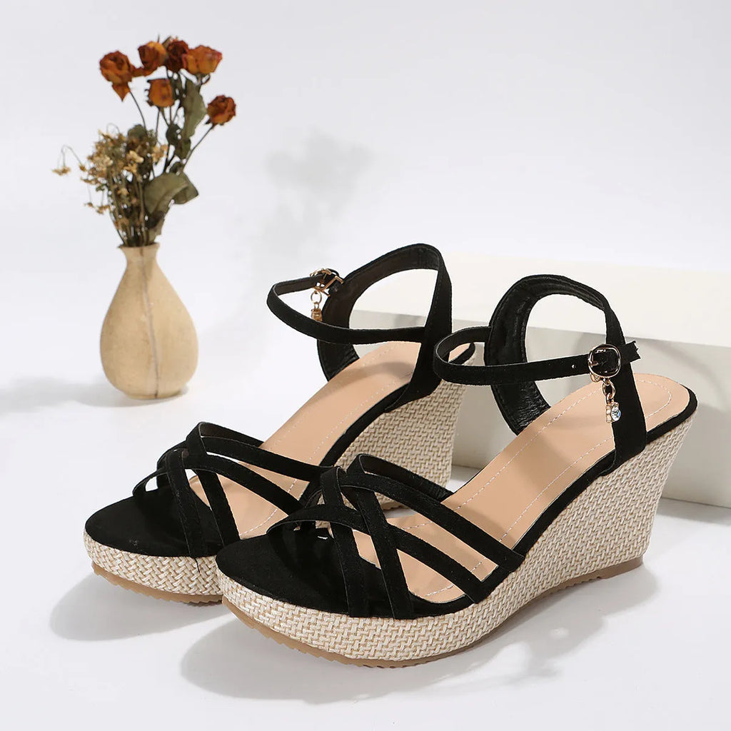Women's black wedge sandals with fish mouth open toe and cloth upper on a white background.