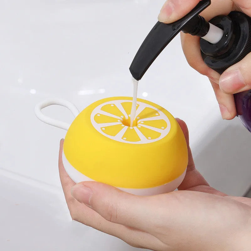 Yellow silicone pet bath brush showing massage head and comb sides on a 102mm scale.