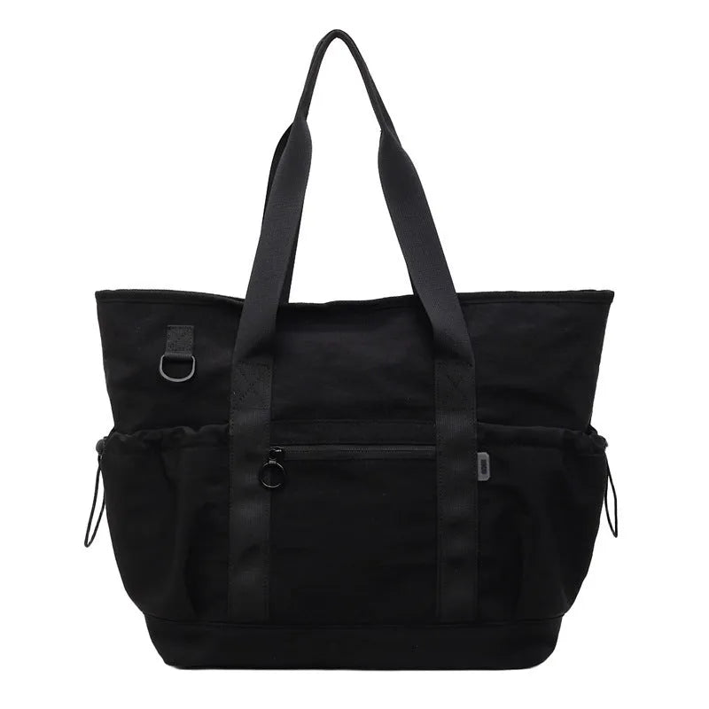 Lightweight Oxford cloth duffel bag for women in grey, shown with a yoga mat.