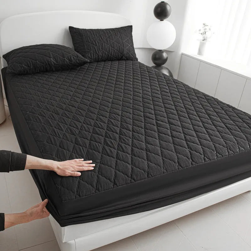 Diamond lattice quilted waterproof mattress protector set with bamboo fibre sheet and pillowcases for a 0.9m bed.