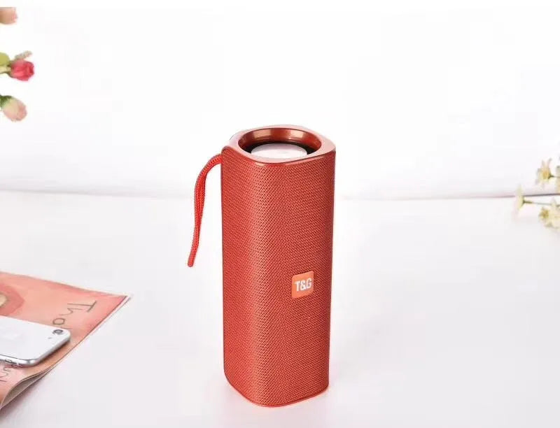 Cloth-covered portable wireless Bluetooth speaker with multiple colour options and control buttons
