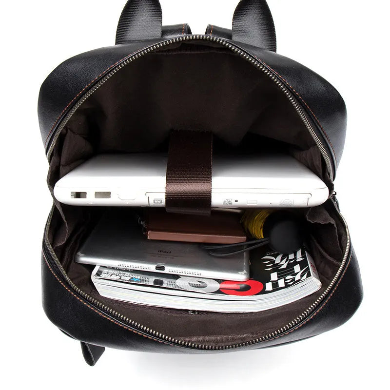 Large black cowhide leather backpack with vertical square shape and shoulder straps