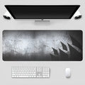 Thickened and lengthened non-slip mouse pad in black with natural rubber base and fine cloth surface for optical mice