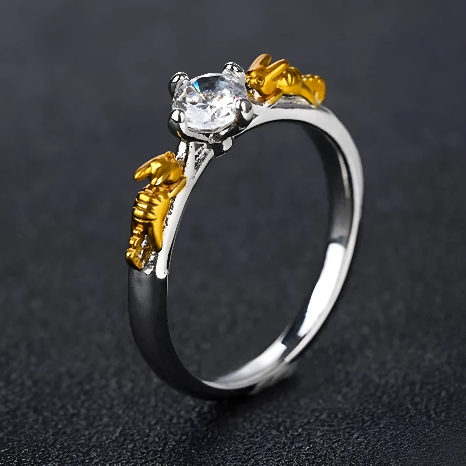 A black gold finished crown motif ring on a copper base, shown on a finger, with detailed modelling visible.