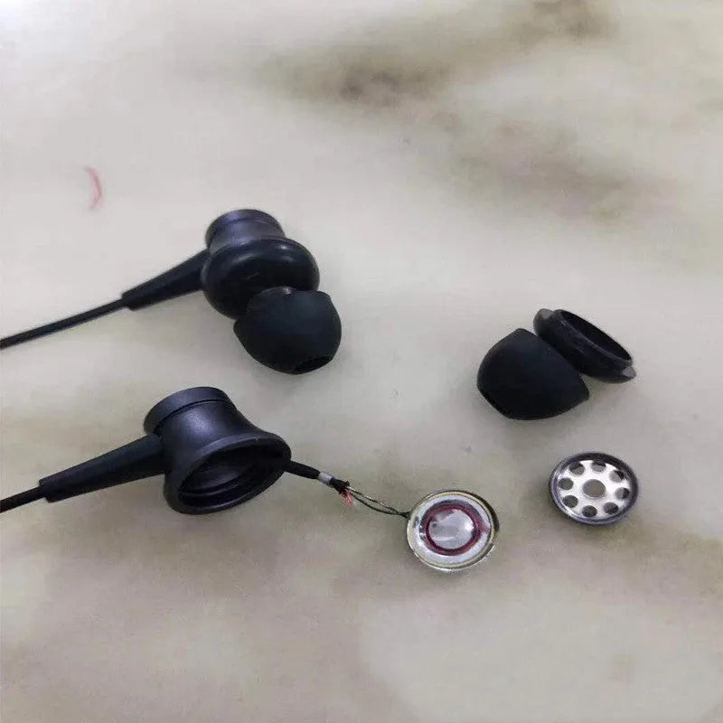 Piston-style wired in-ear headphones with 3.5mm jack in black, blue, and red colour options.