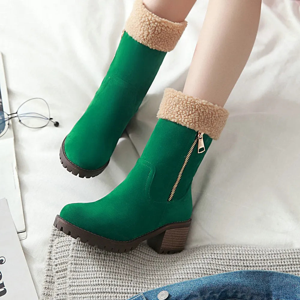 A pair of black snow boots with a plush lining and rubber insole on a winter background.