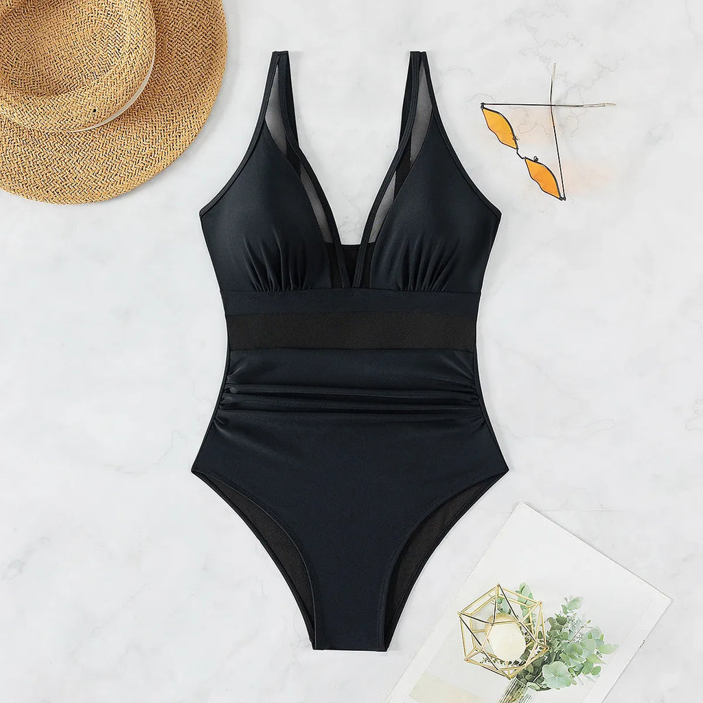 Black women's one-piece swimsuit with halter neck and briefs style, made from nylon fabric