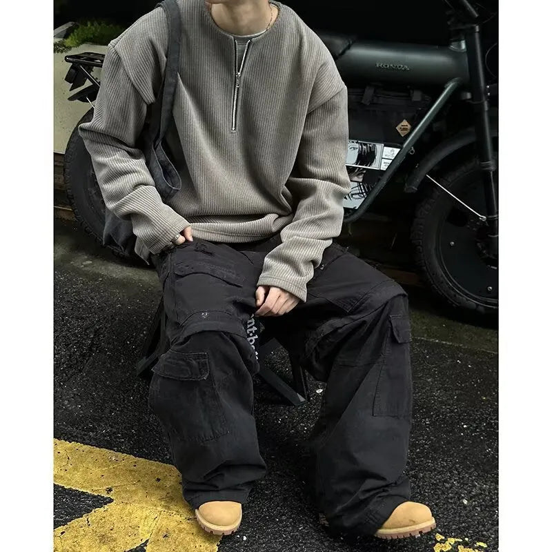 Solid colour loose fit long sleeve pullover top in grey, black, or apricot.