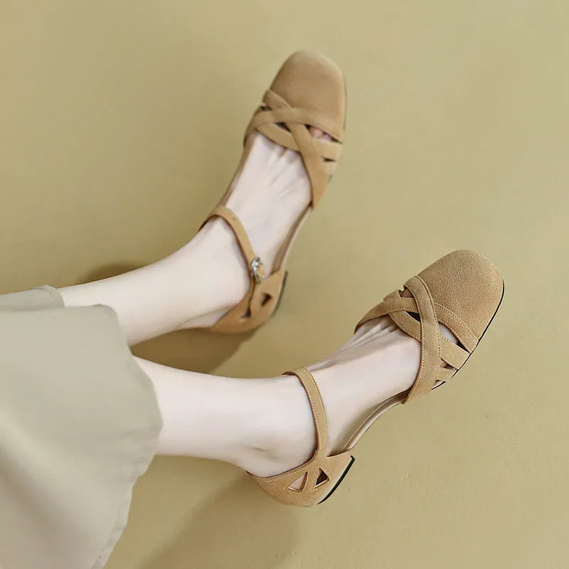 Apricot and green Roman sandals with round toe and buckle fastening.