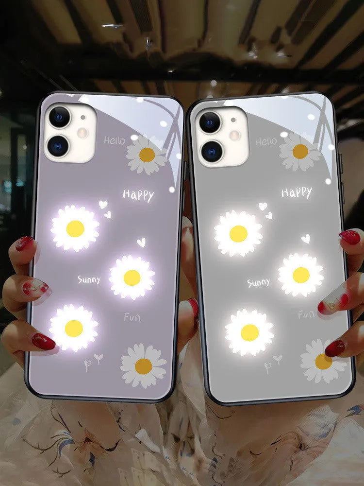 Luminous purple and white daisy iPhone case with voice-activated colour lights on a phone.