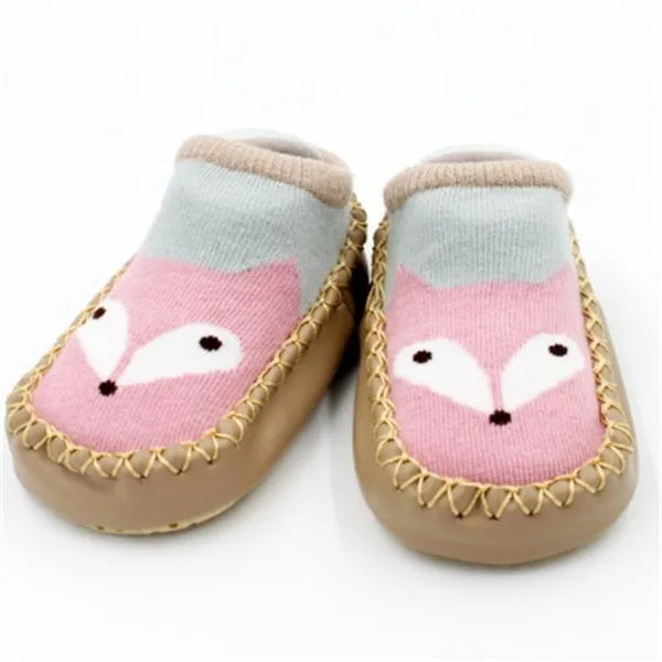Pair of pastel coloured baby socks with anti-slip dots on the sole, shown flat.