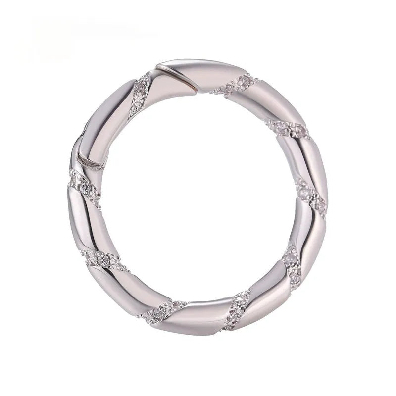 Copper climbing heart button fastener with micro-inlaid zircon stones and gold electroplating.