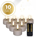 Taupe-coloured LED tealight candle with realistic 3D flickering flame effect on a table.