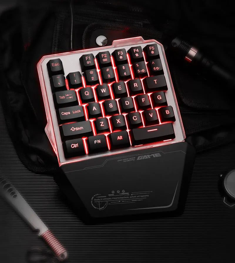Black Robotic G40 Flow one-handed mechanical keyboard with RGB backlit keys on a desk.
