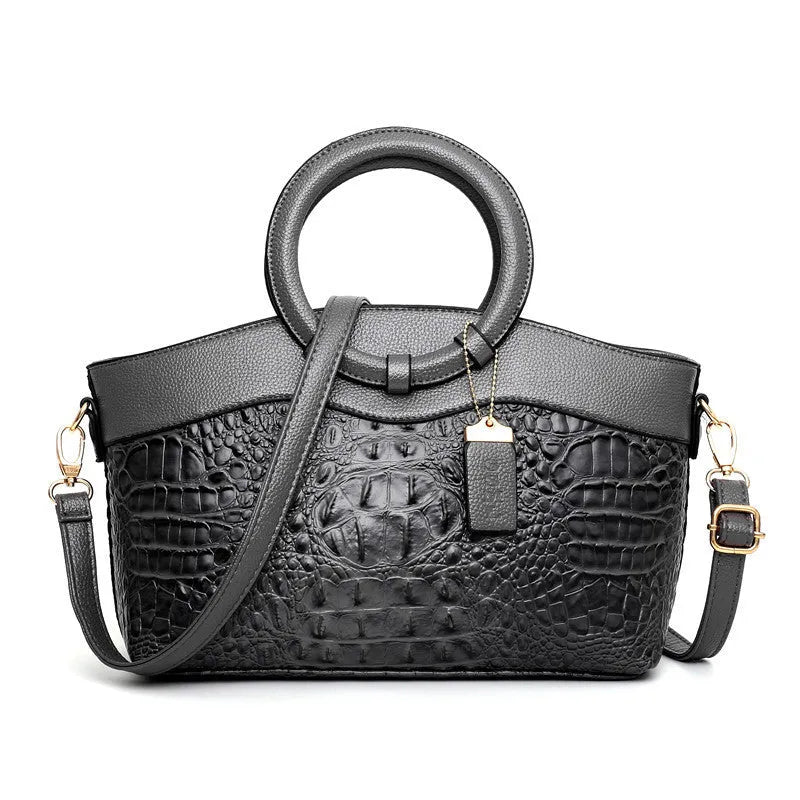A casual high-quality fabric handbag in a chosen colour, showing the zippered main compartment and front detailing.