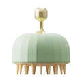 Green double-sided silicone pet bath massage brush with drain holes on a white background.