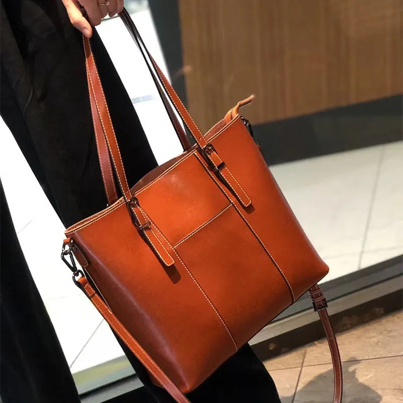 Brown genuine leather women's shoulder bag with retro styling and multiple organisational compartments