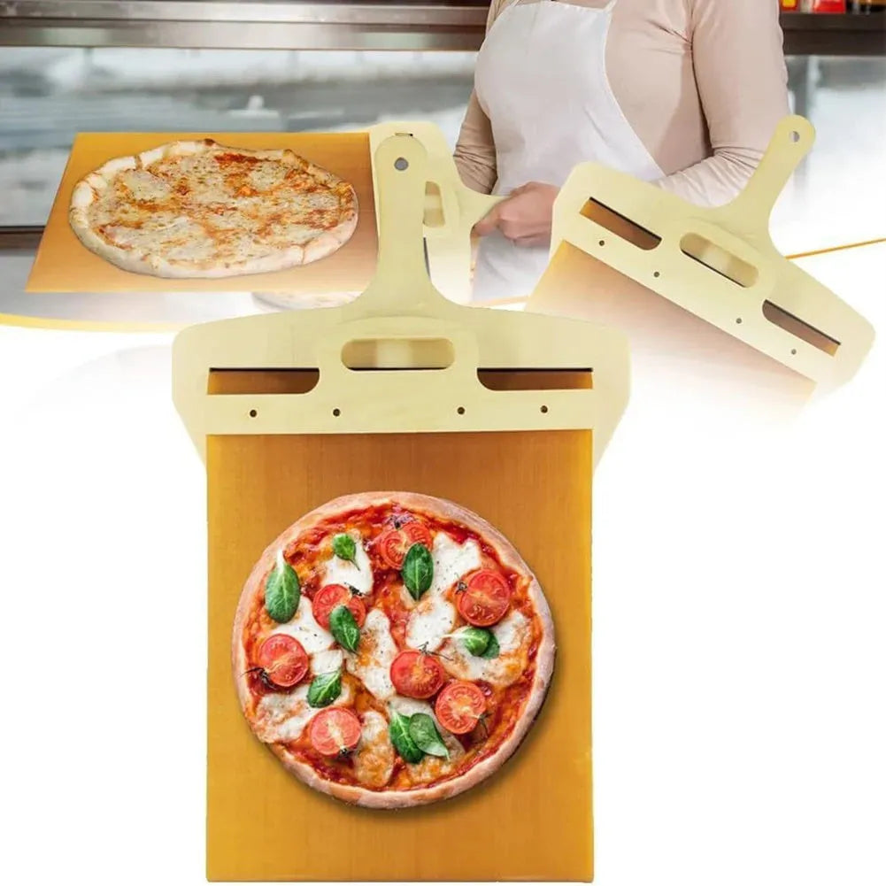 White food-grade PP plastic pizza transfer shovel with a hanging hole, shown on a kitchen counter.