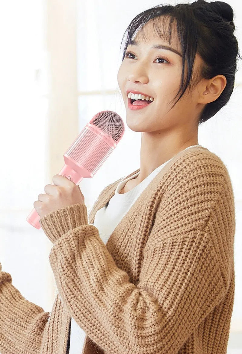 Wireless Bluetooth karaoke microphone in pink, blue, and green colour options