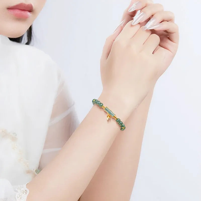 Cargo jade bracelet with blue water round beads on a S925 sterling silver chain.