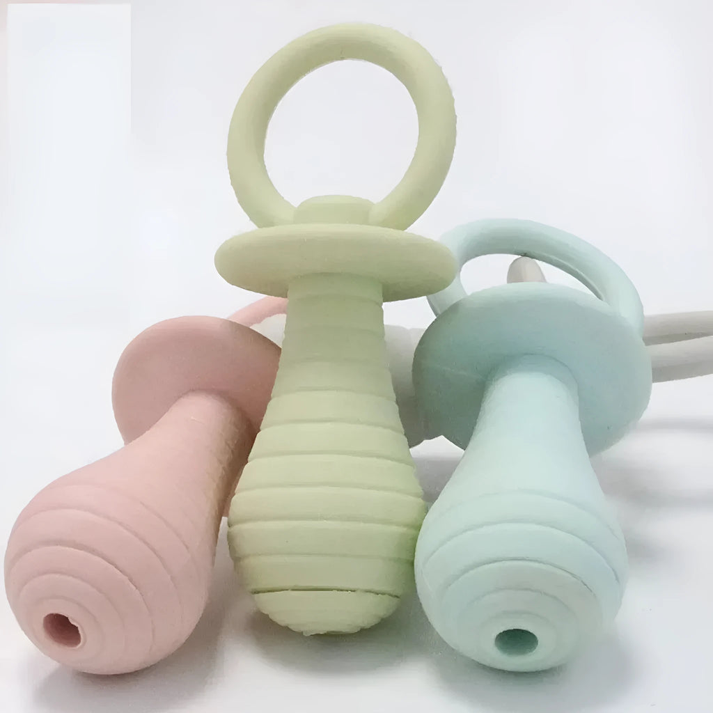 Four coloured pet pacifier chew toys with squeaker for puppies and kittens