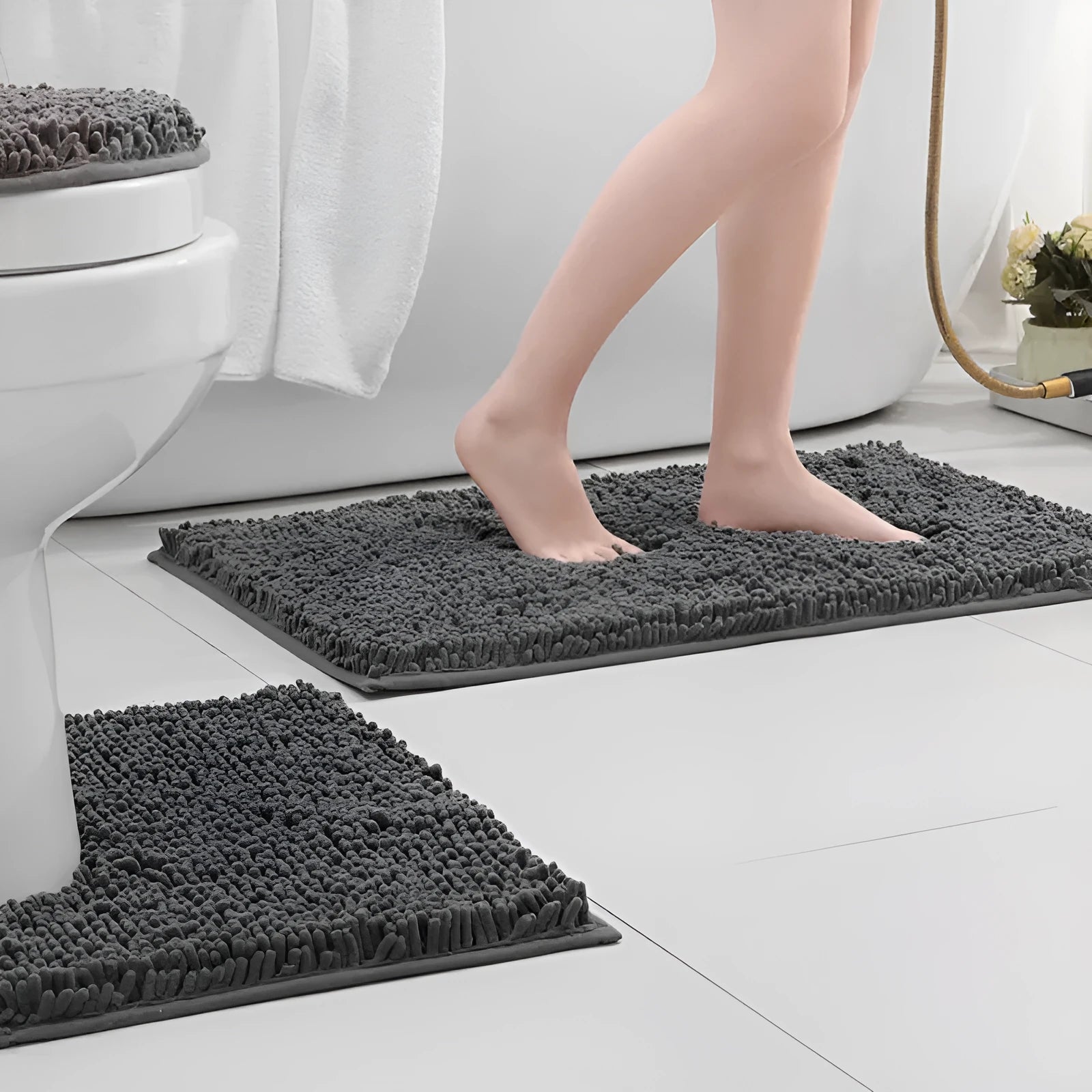 Chenille U-shaped three-piece bathroom carpet set in green beside a toilet.