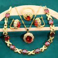 Complete gold plated jewellery set with colourful cubic zirconia stones, showing ring, earrings, bracelet and necklace.