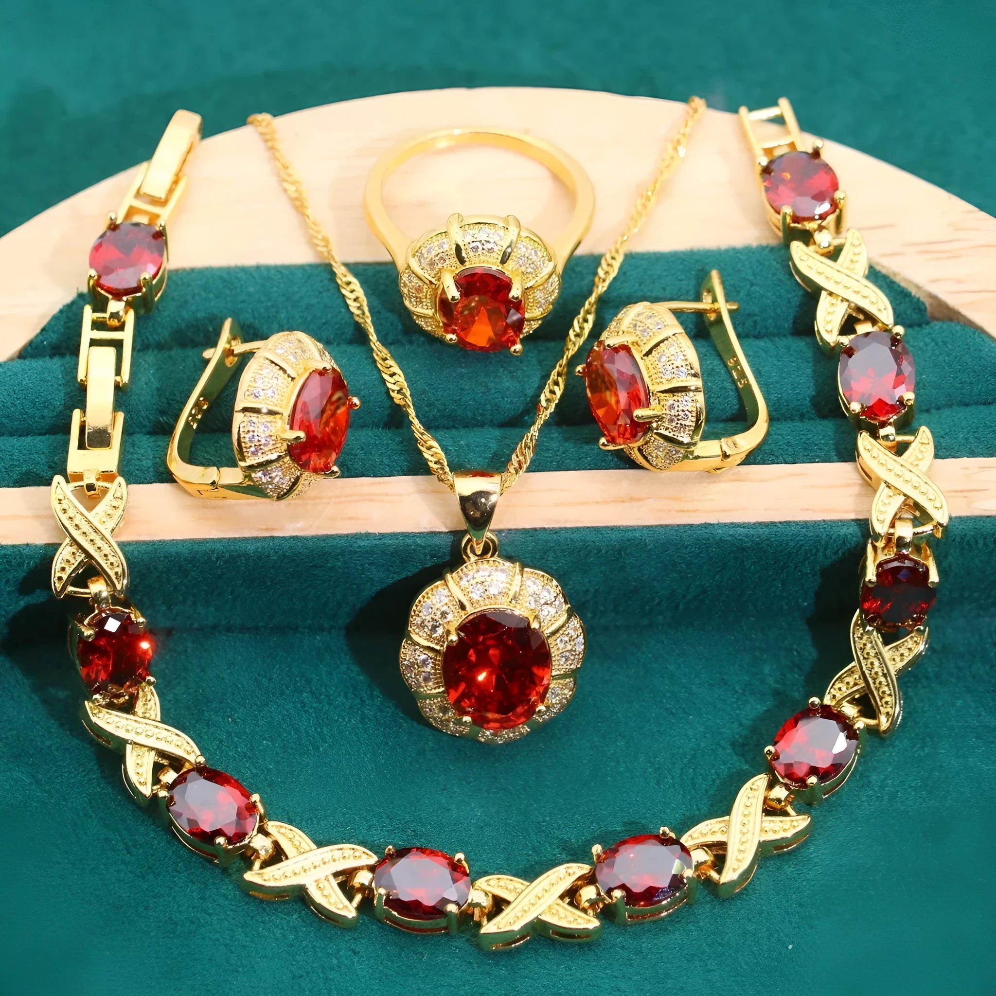 An 18k gold plated jewellery set featuring a necklace, earrings, a ring, and a bracelet with coloured cubic zirconia stones.