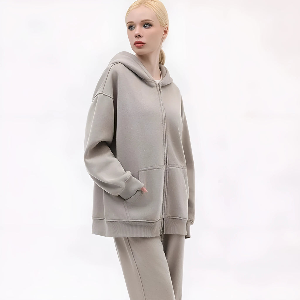 Women's distressed fleece-lined hooded cardigan sweater in a loose fit with patch pockets.