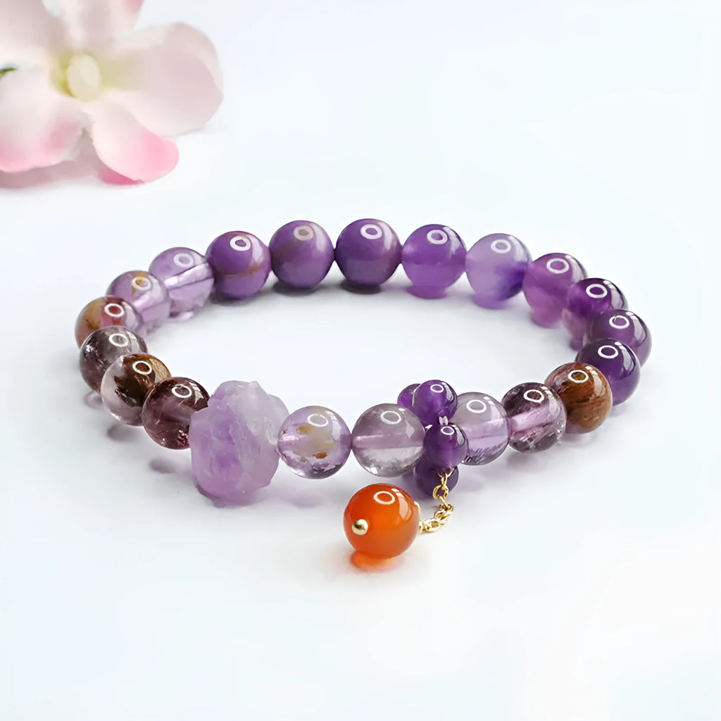 Nine purple amethyst and red agate crystal bracelet showing 8mm beads and Mori style design
