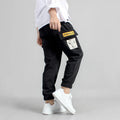 Boys' cotton track pants in black and grey, sizes 120-160cm, with elasticated hips
