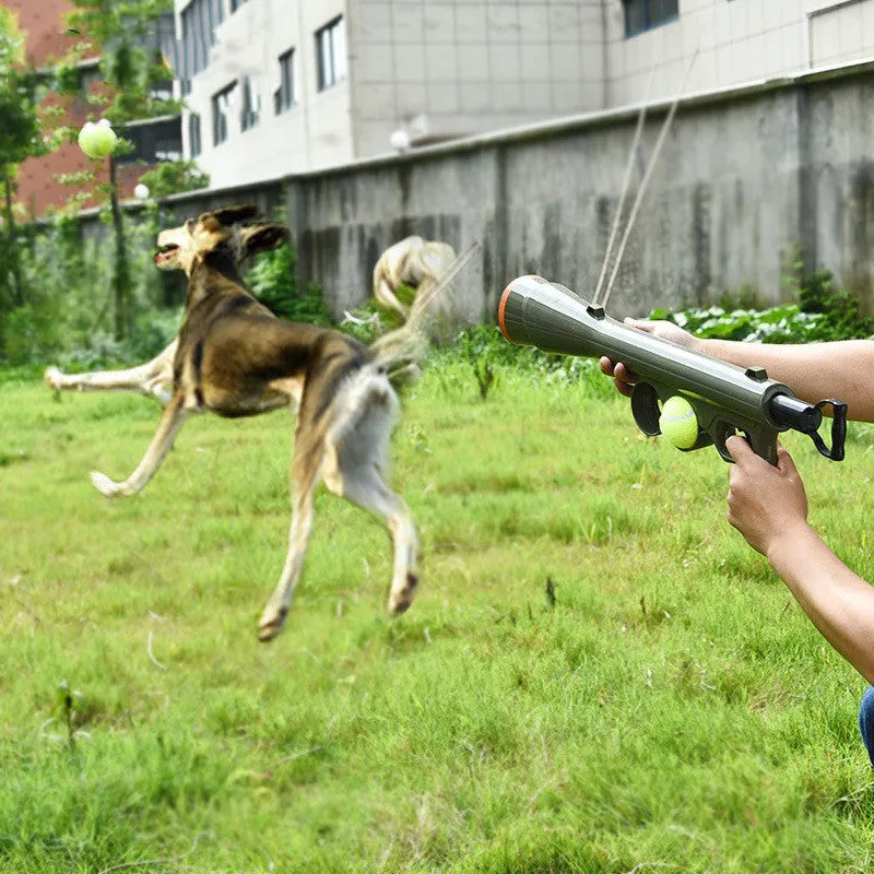 Black ABS plastic tennis ball launcher for dogs with two included tennis balls