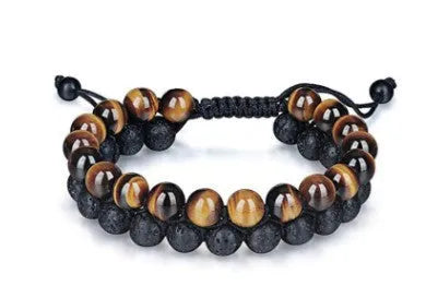 Tiger's Eye and Lava Stone bracelet on wrist, golden yellow tiger's eye and black lava beads