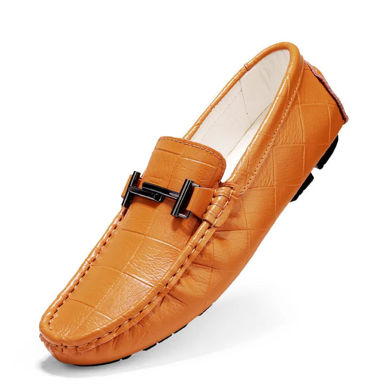 Men's black casual leather shoes with a silver belt buckle detail on the front.