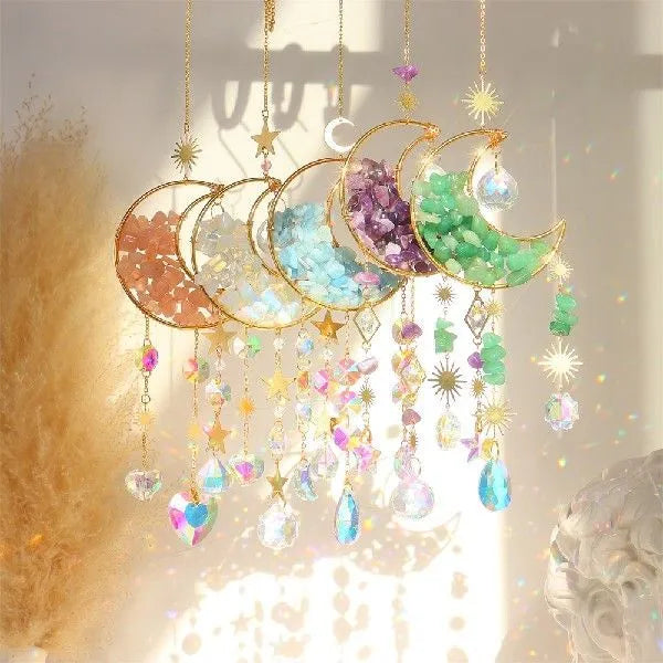 Moon-shaped K9 crystal car pendant on a metal base with a hanging chain.