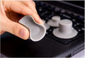Four grey durable plastic laptop cooling pads, two large and two small, on a wooden desk