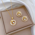 Titanium steel jewellery set with geometric leaf design necklace and matching stud earrings