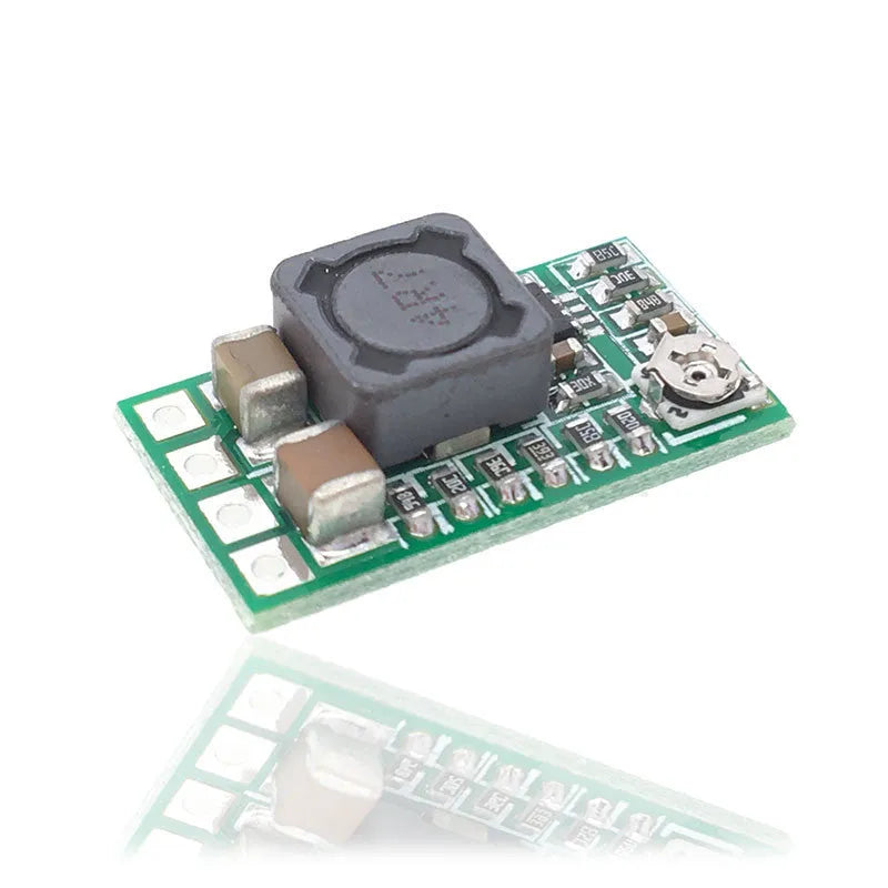 Green PCB mini DC-DC step down power supply module converting 12-24V to 5V 3A.