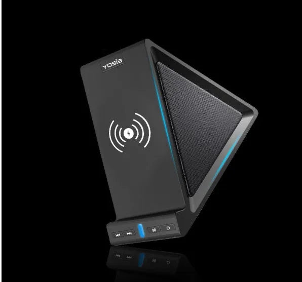 Matte black Bluetooth speaker with integrated phone stand and wireless charging pad on top.