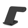 Black and white wireless phone charger with Type-C cable on a desk