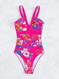 Floral patterned women's one-piece swimsuit with a backless bikini-style design