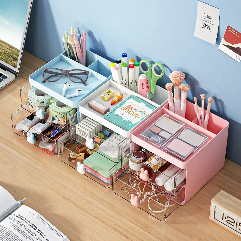 Transparent plastic desktop storage box with internal grid partitions, shown in pink colour.