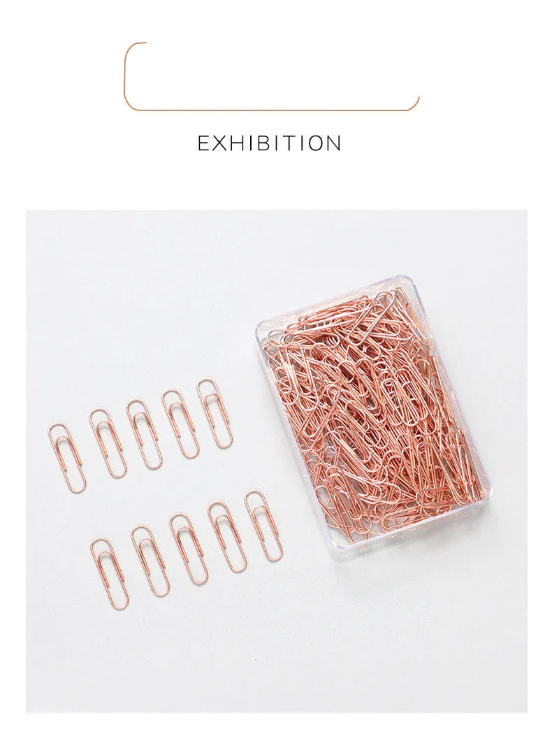 Rose gold coloured heart-shaped metal paper clips, pack of 100 pieces.