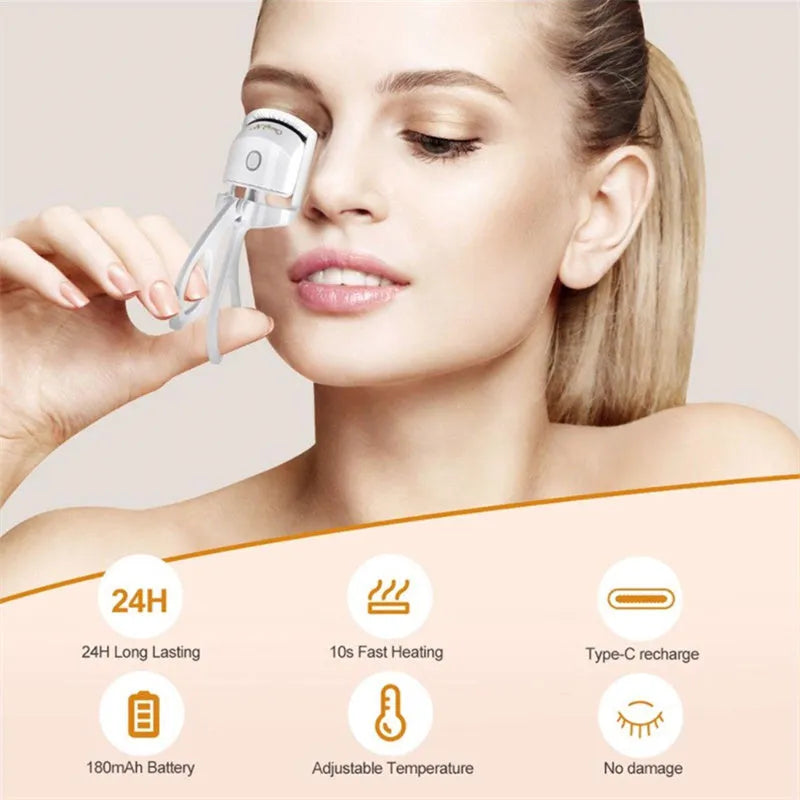 White and pink USB rechargeable heated eyelash curler with temperature control settings.