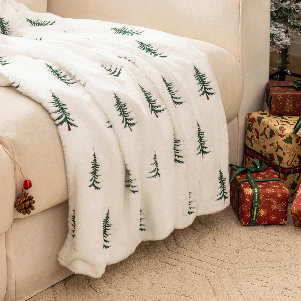 Christmas plush sofa blanket with embroidered tree design, white polyester, 127x152cm, on a sofa