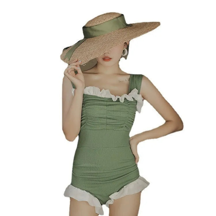 High-waisted one-piece swimsuit in quick-dry polyester fabric, shown in black.