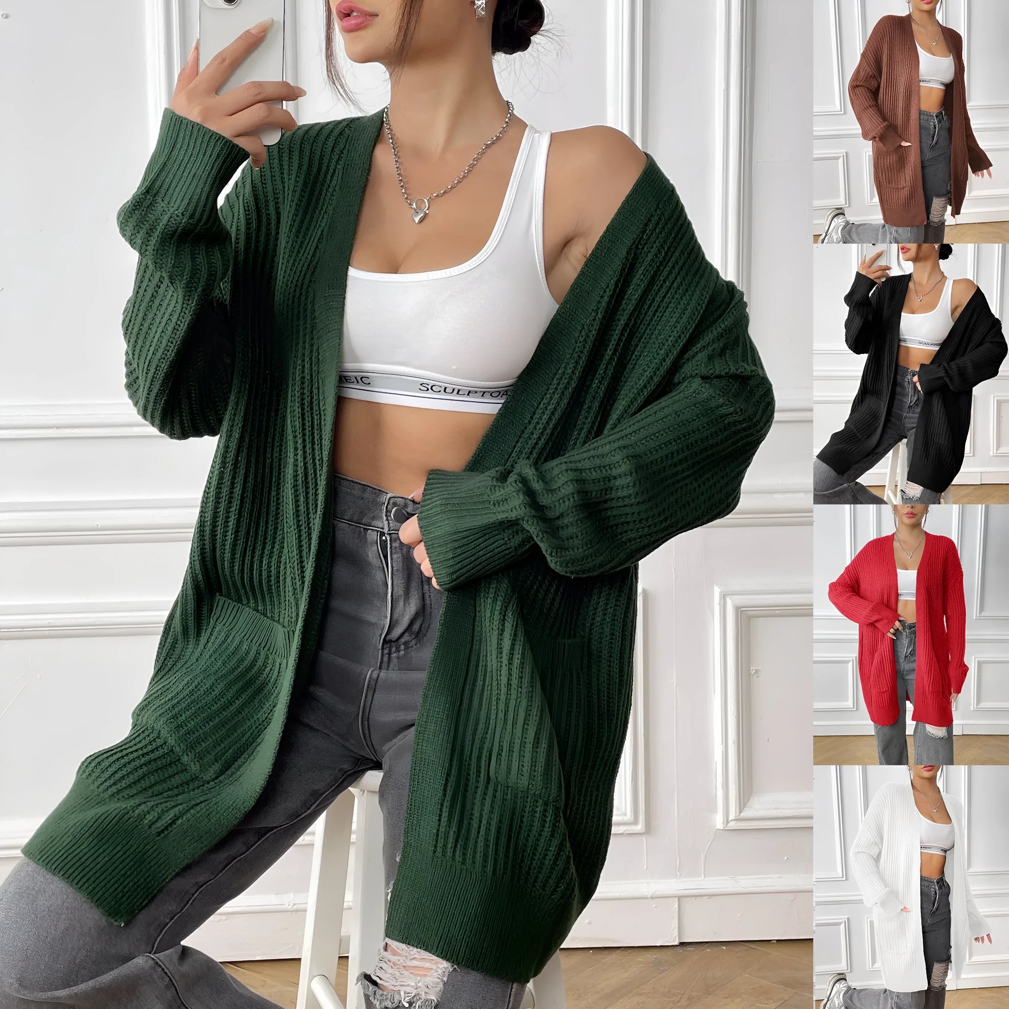 Women's dark green loose cardigan with two front pockets and long sleeves.