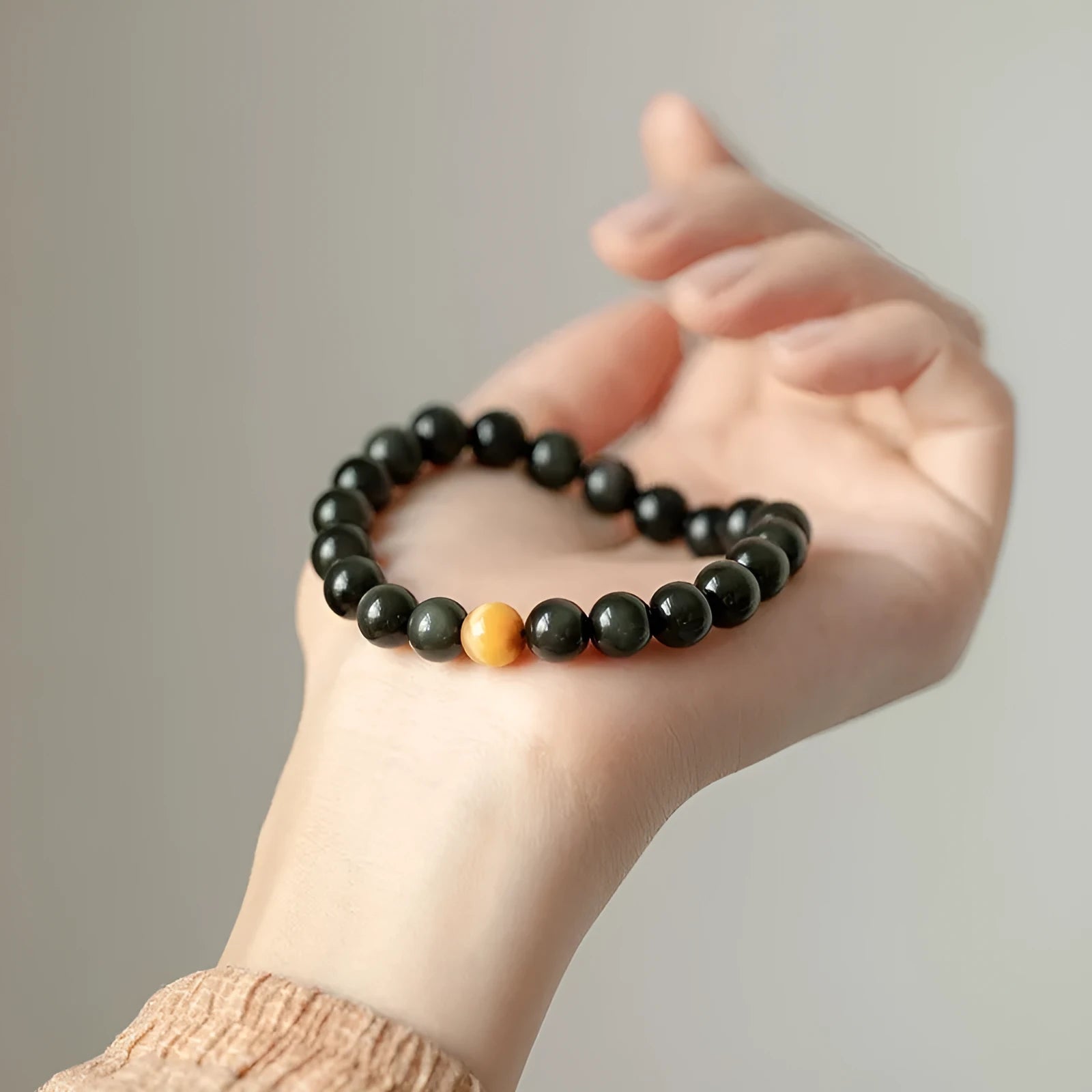 Korean-style geometric obsidian bracelet with natural eye pattern stones
