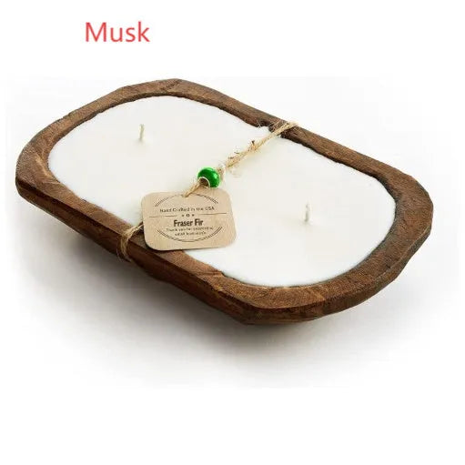 Lavender-scented soy wax candle in a wooden basin with a wooden wick