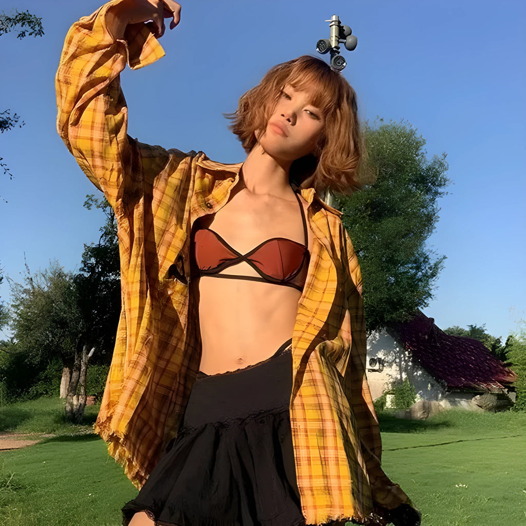 Yellow and white plaid shirt with a loose cardigan fit on a hanger.